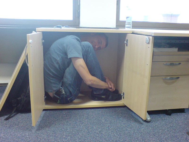 image of a man inside a cupboard