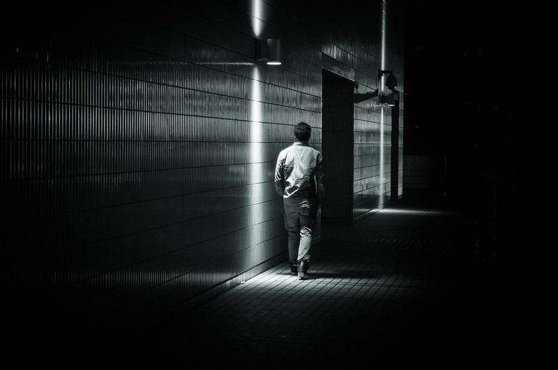 image of man walking alone
