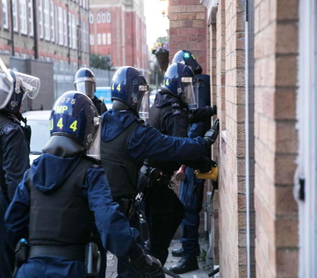 image of police officers during a raid