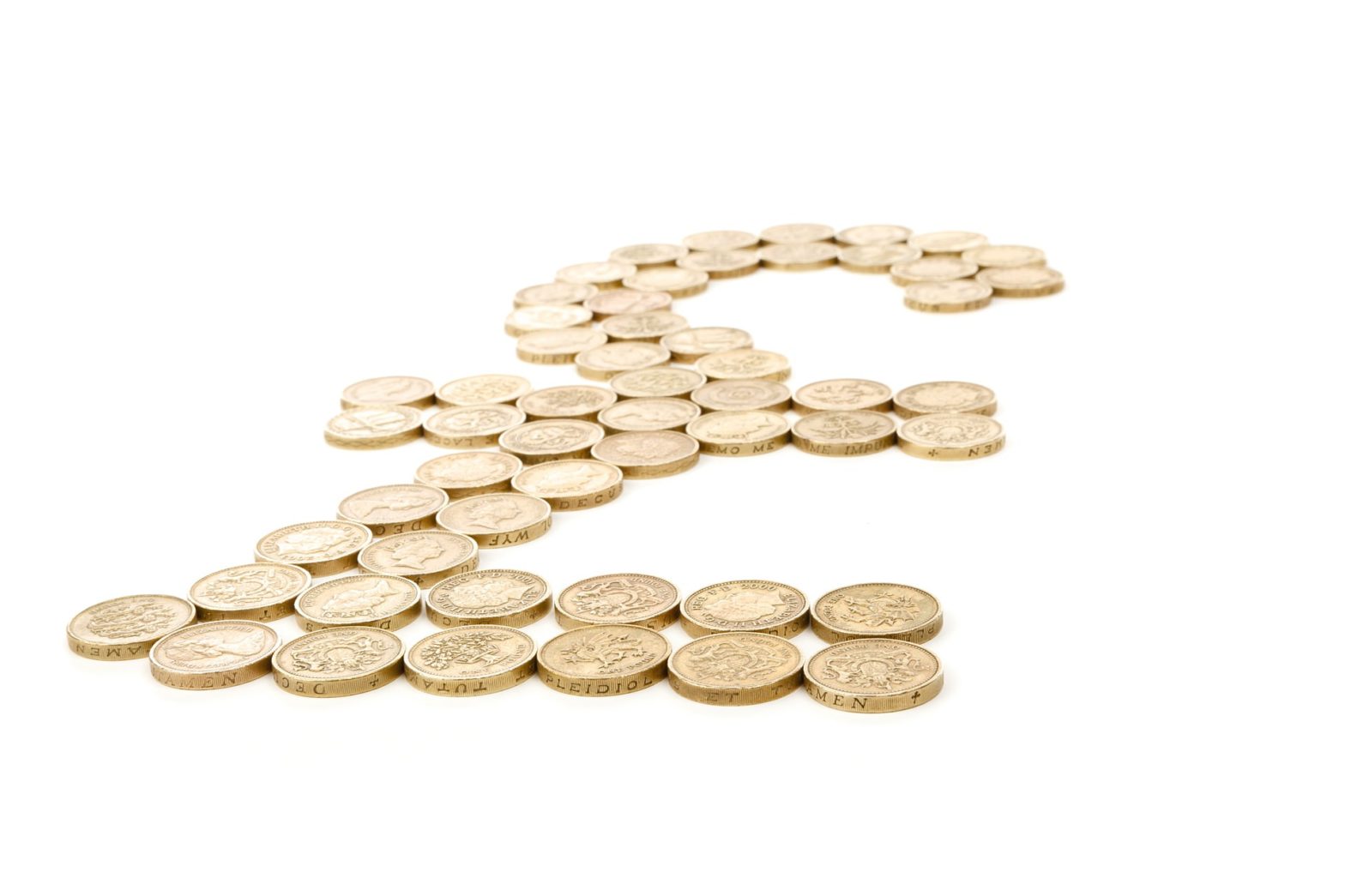 pound coins laid out in the shape of a pound symbol