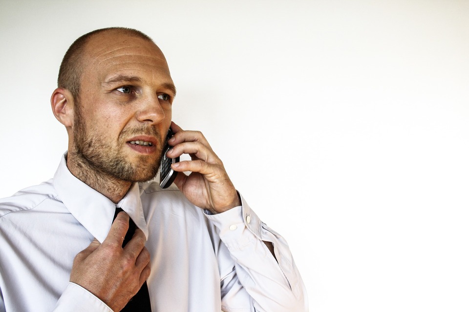 image of man in tie on the phone