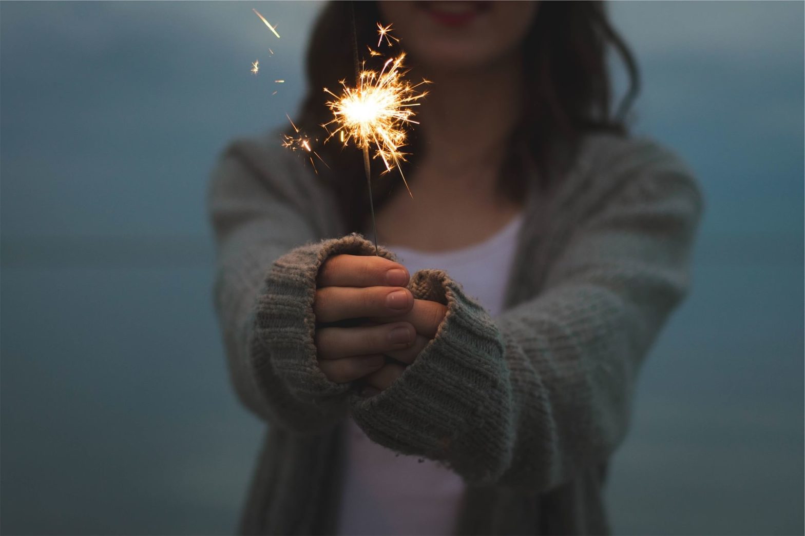 woman holding a sparkler