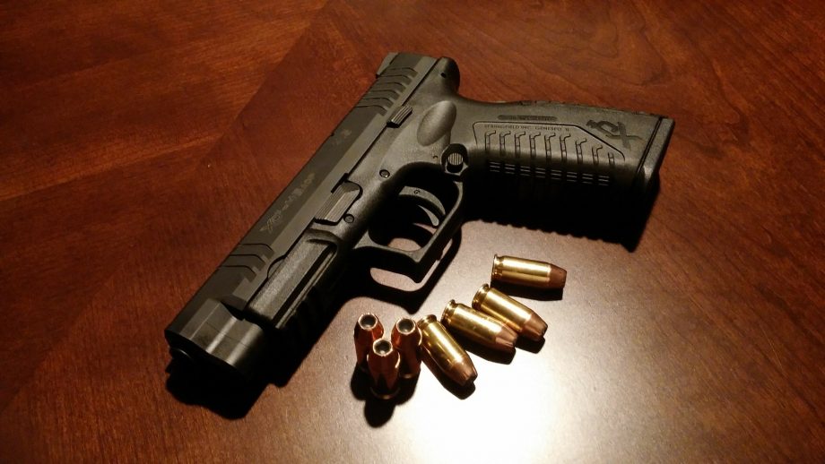 image of gun with bullets