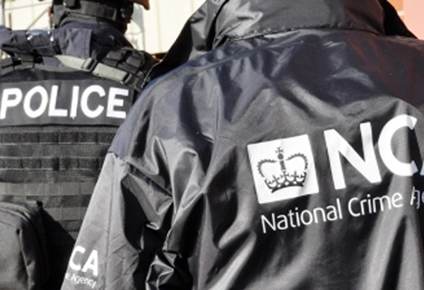 image of two people wearing police and NCA jackets