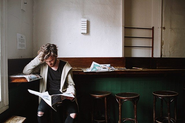 image of man reading the newspaper