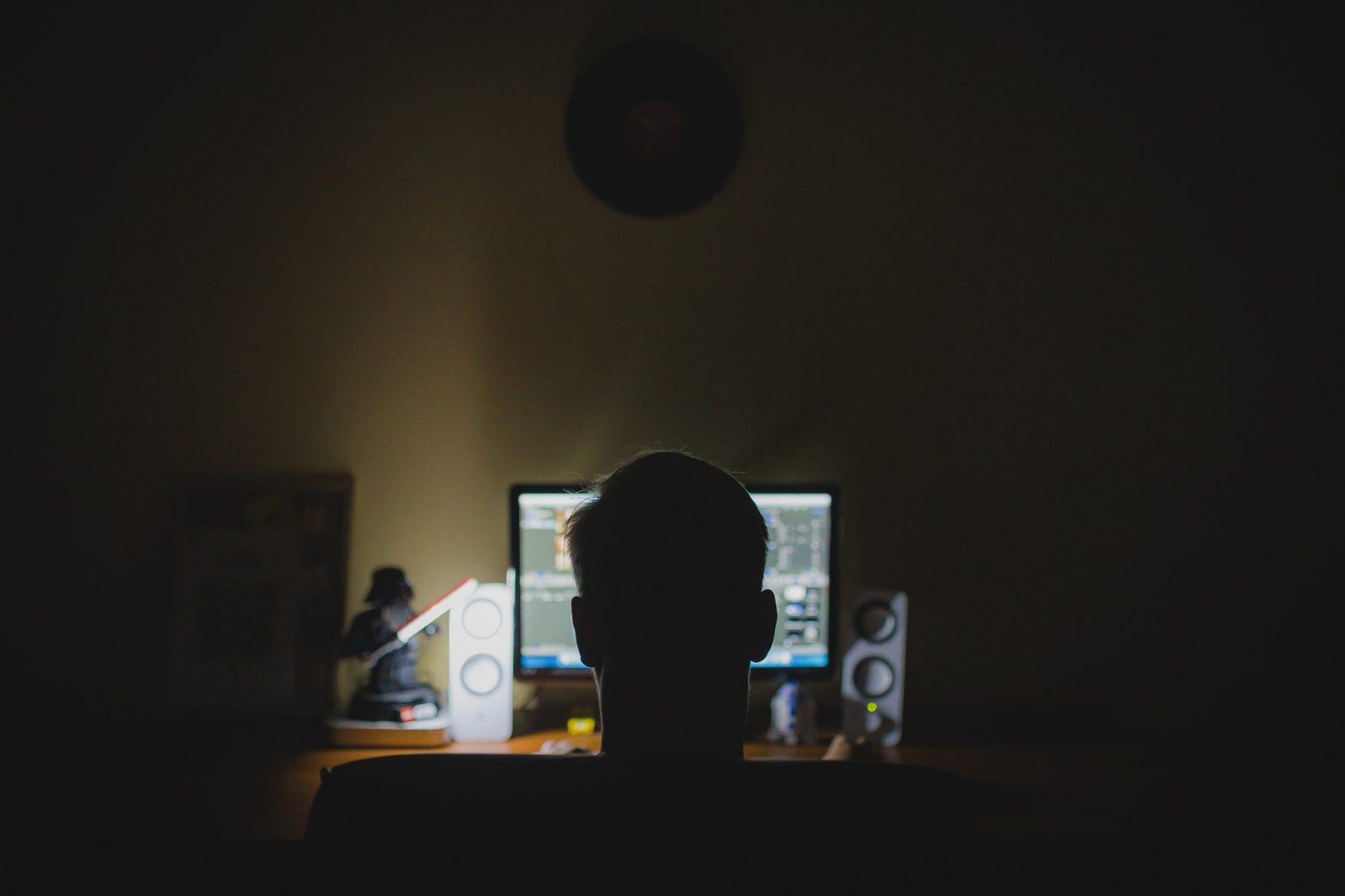 image of man at a computer screen
