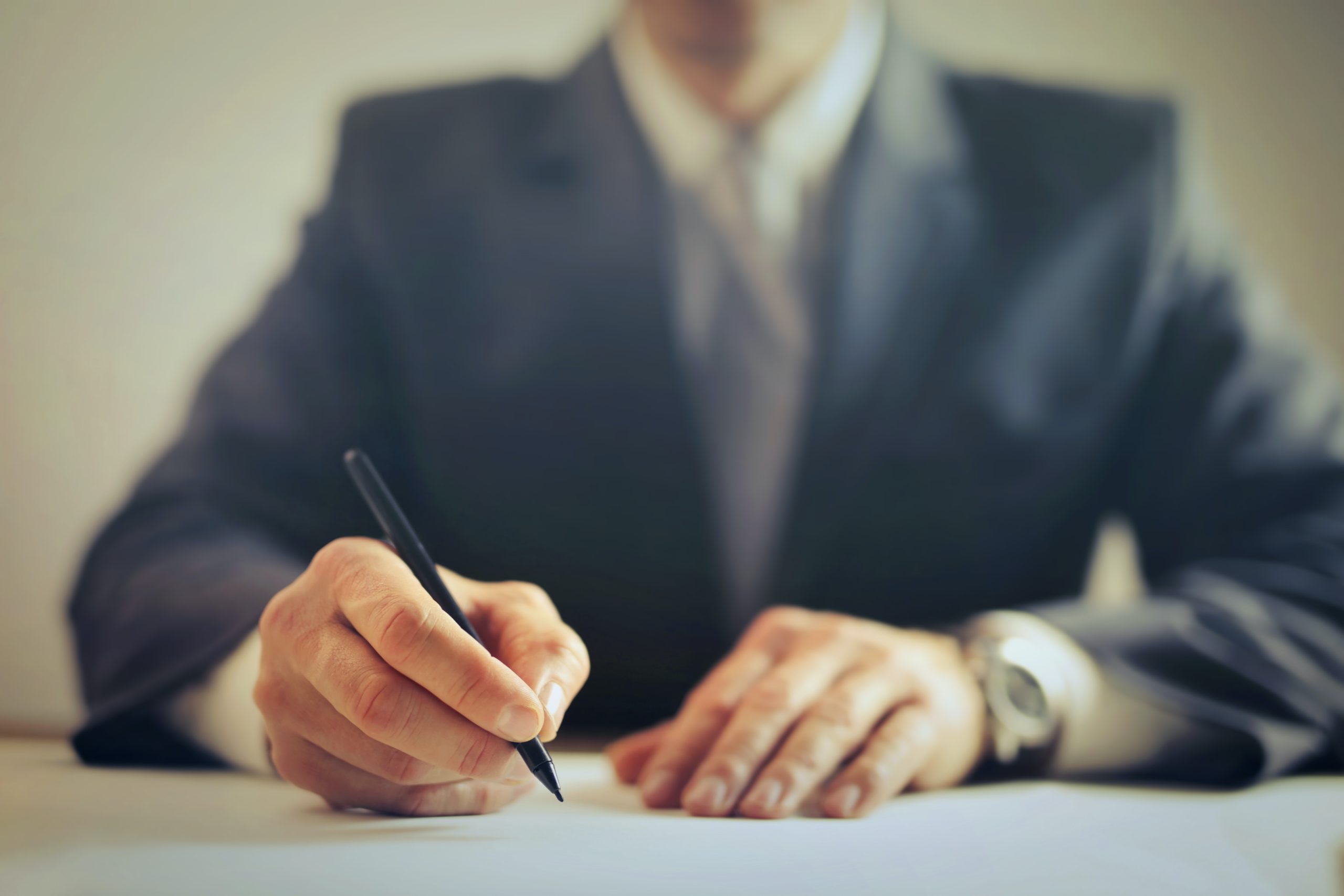 image of a man writing a document