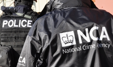 image of police officers in black NCA jackets
