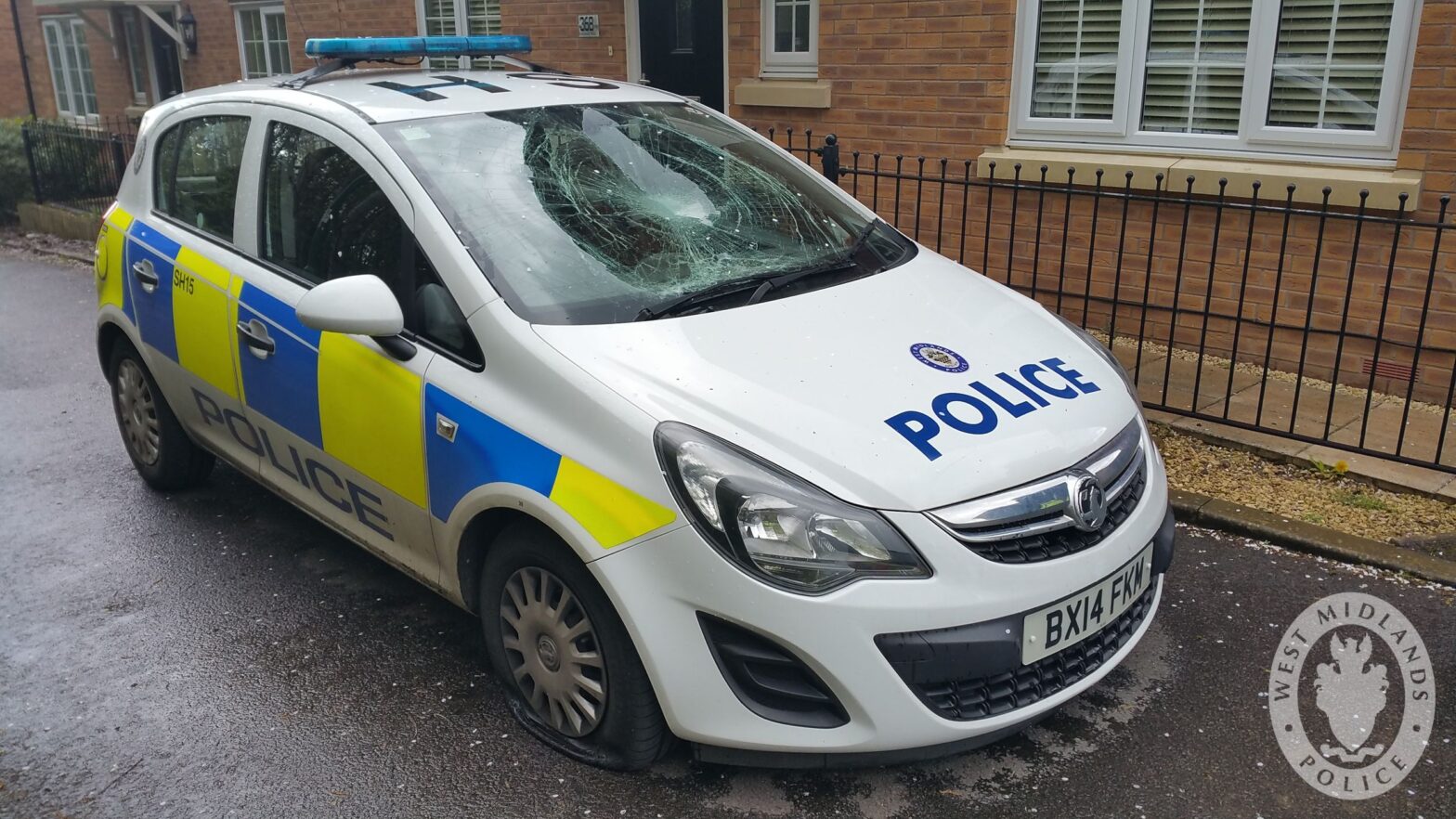 image of a damaged police car