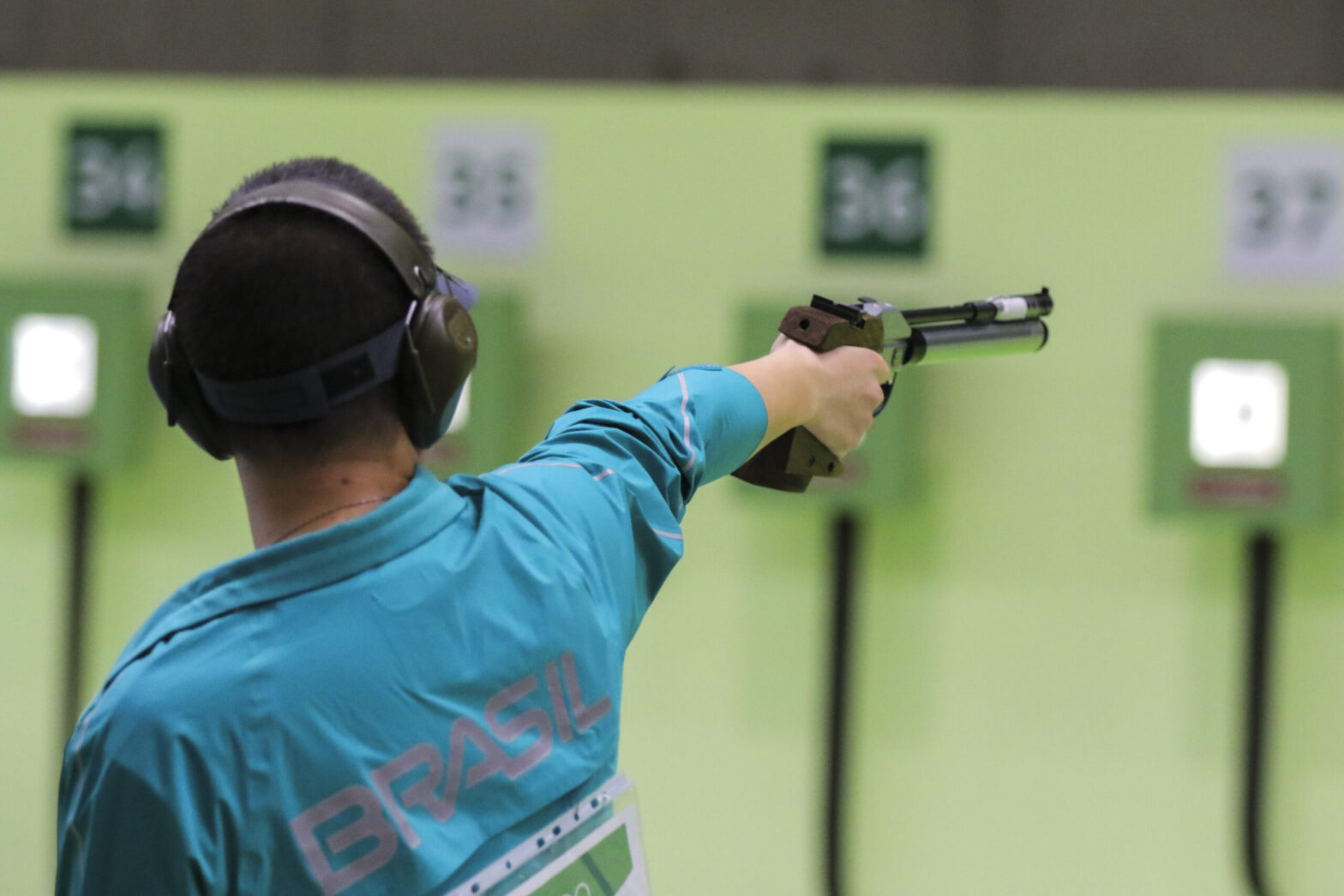 image of a man shooting an air pistol