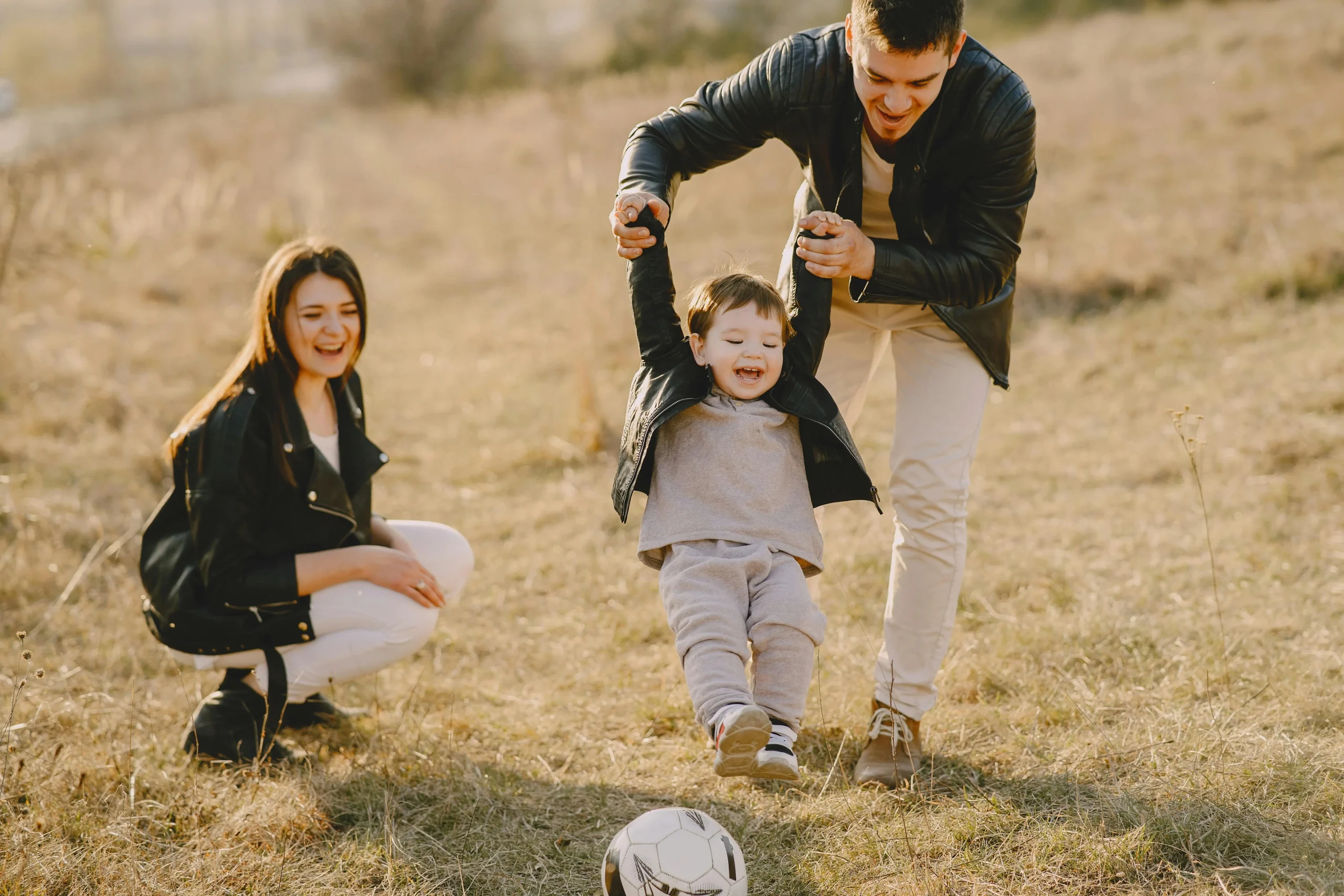 Family of 3 in field.